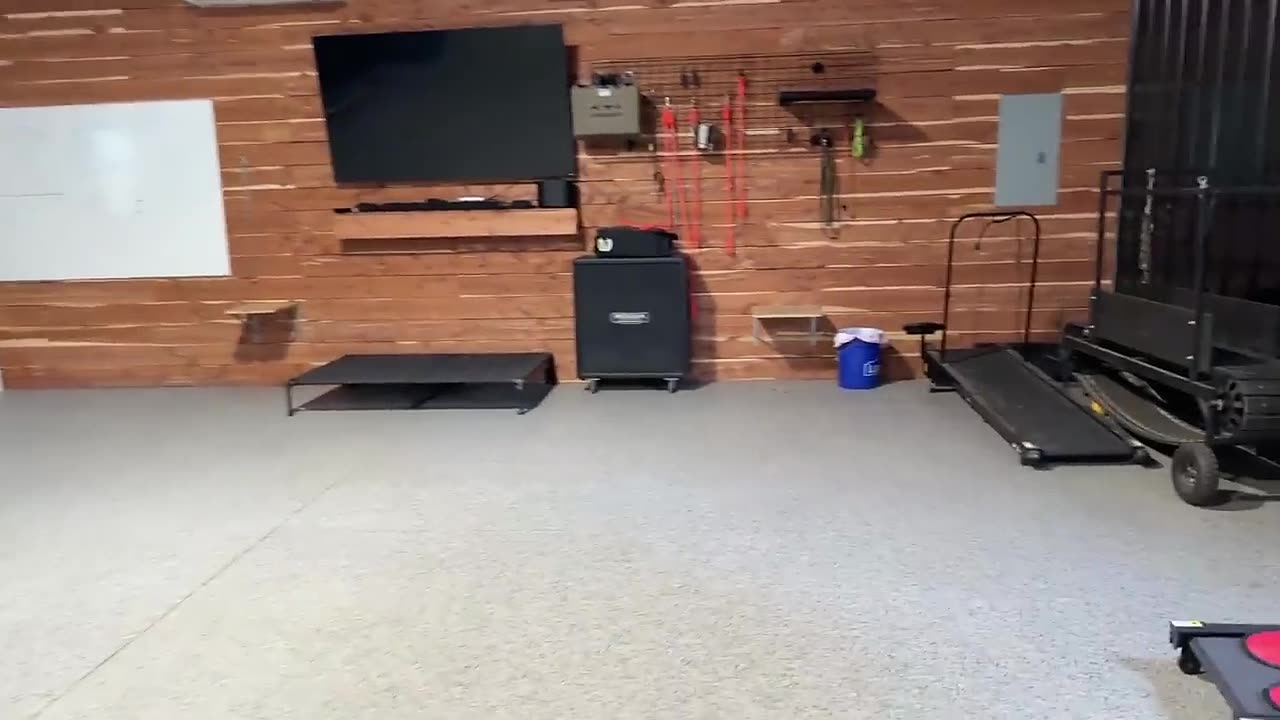 A purpose-built indoor training room at Agoge K9 with conditioning equipment and place platforms